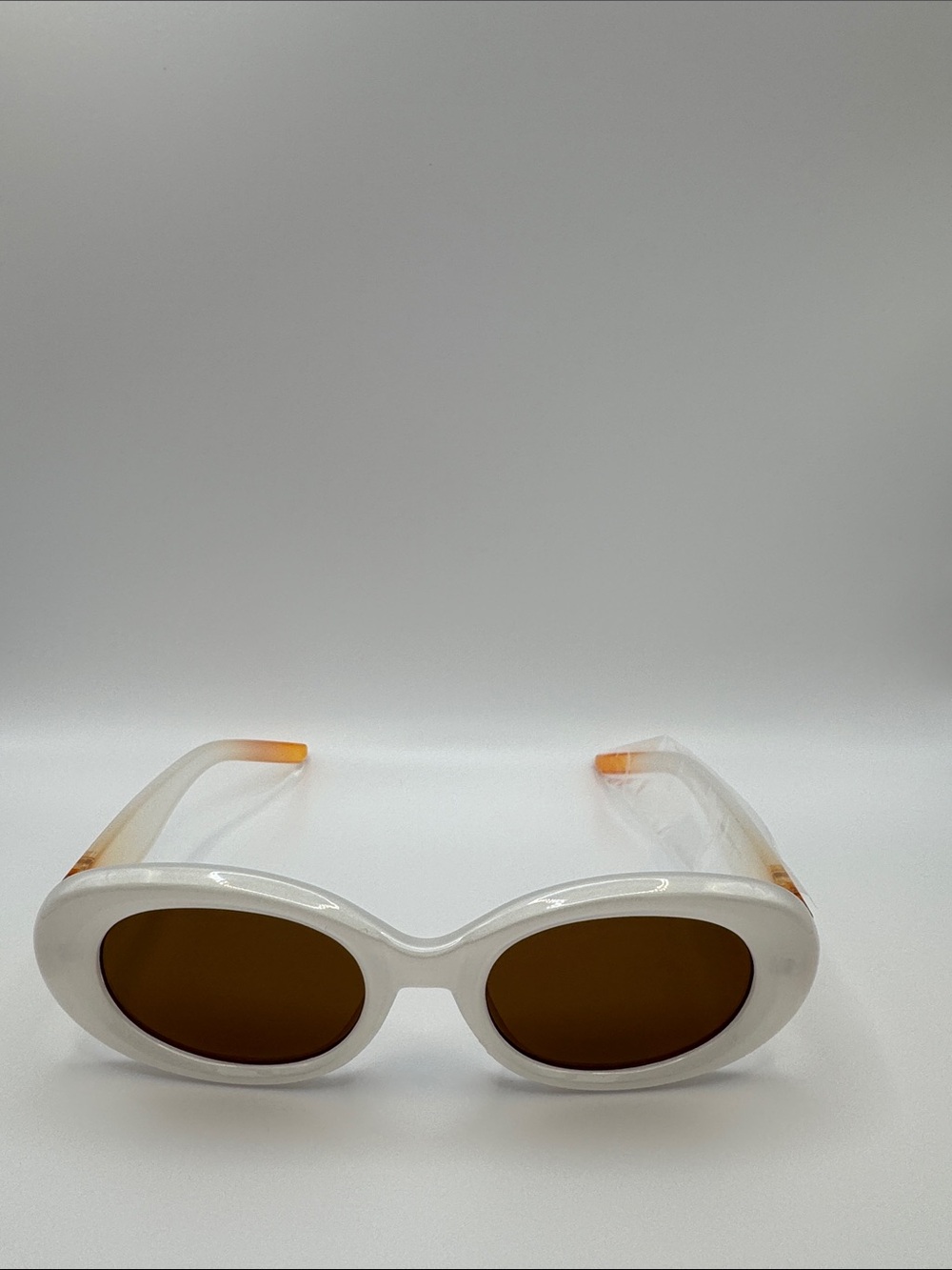 White Oval Frame Sunglasses with Brown Lenses